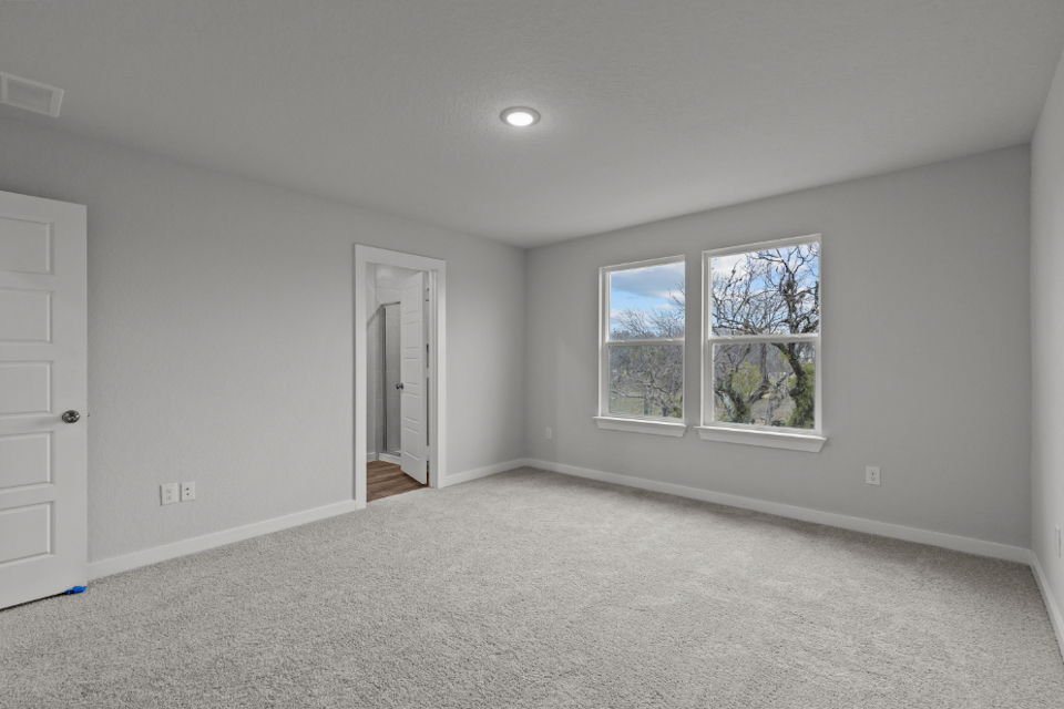 A room with a window and a door.
