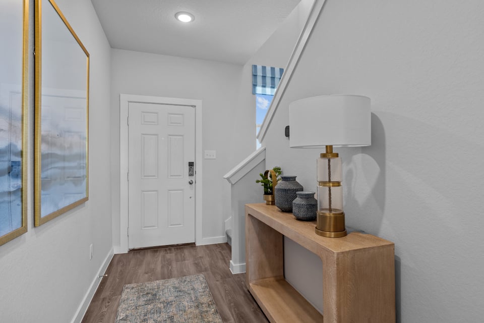 A room with a table and a lamp.