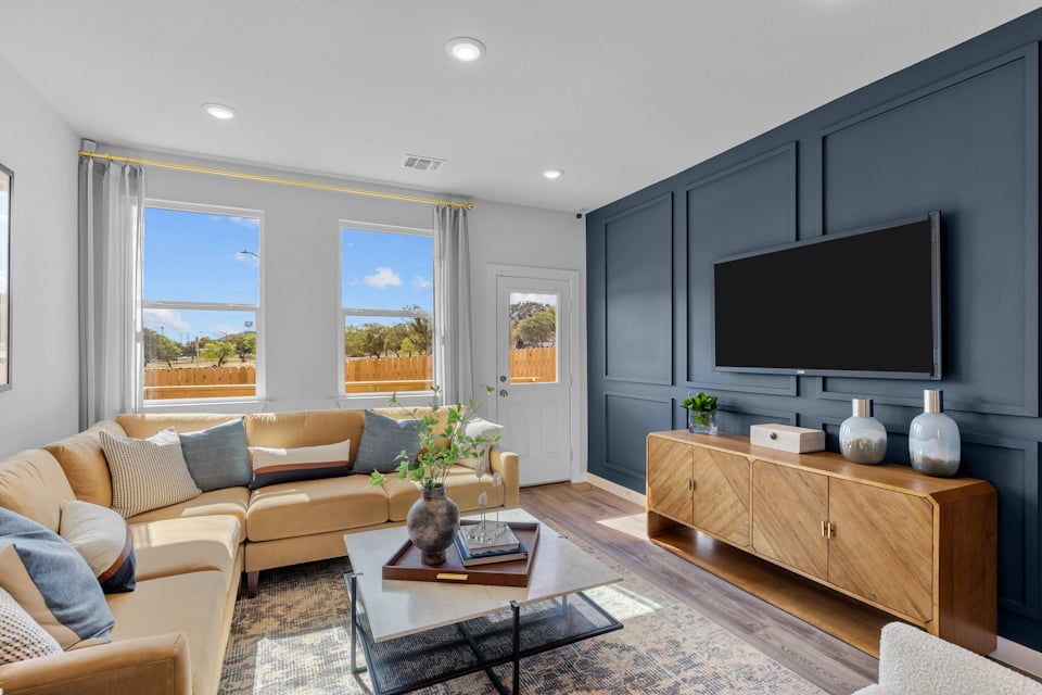 A living room with a tv and couches.