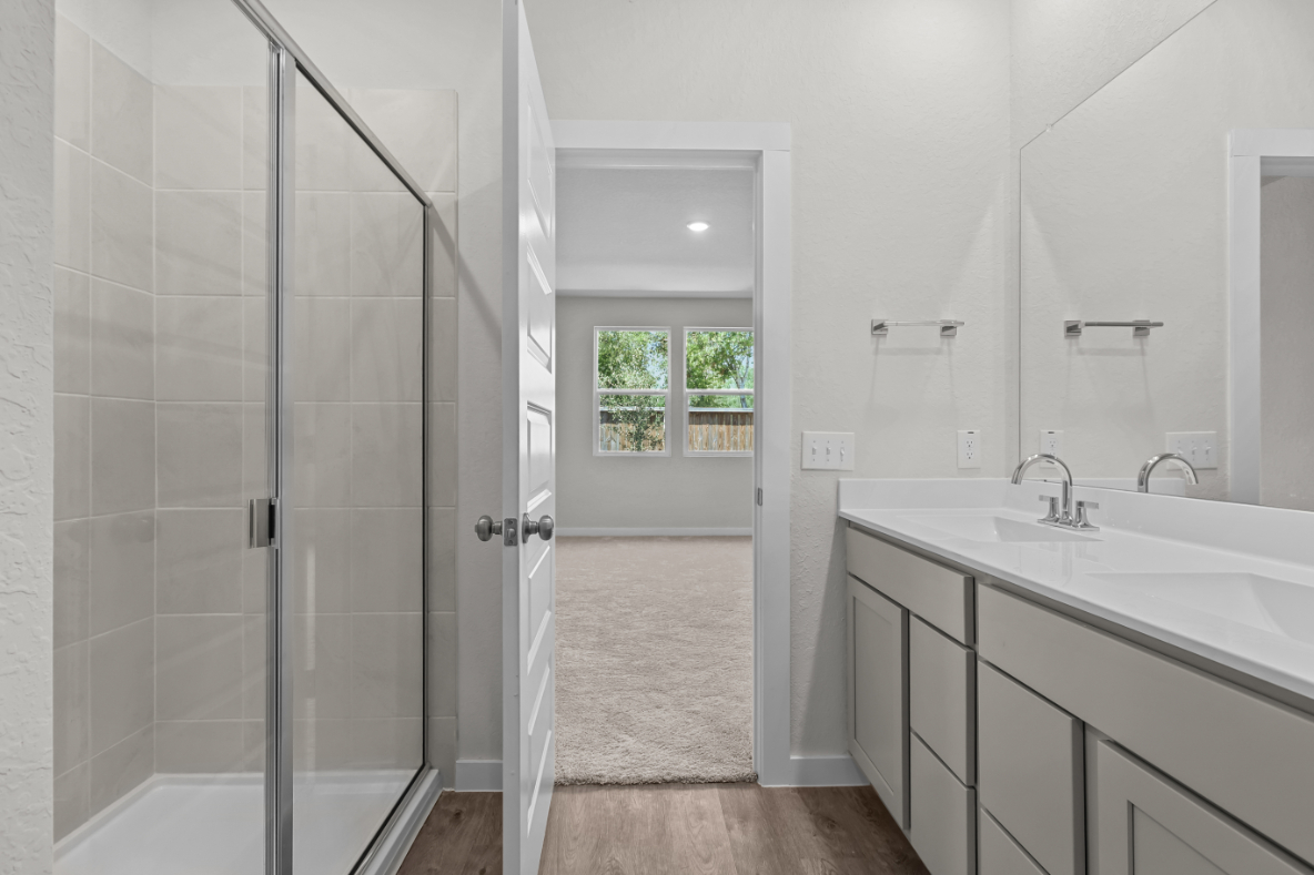 A bathroom with a glass shower.