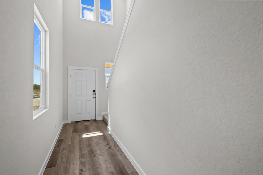 A hallway with white walls.