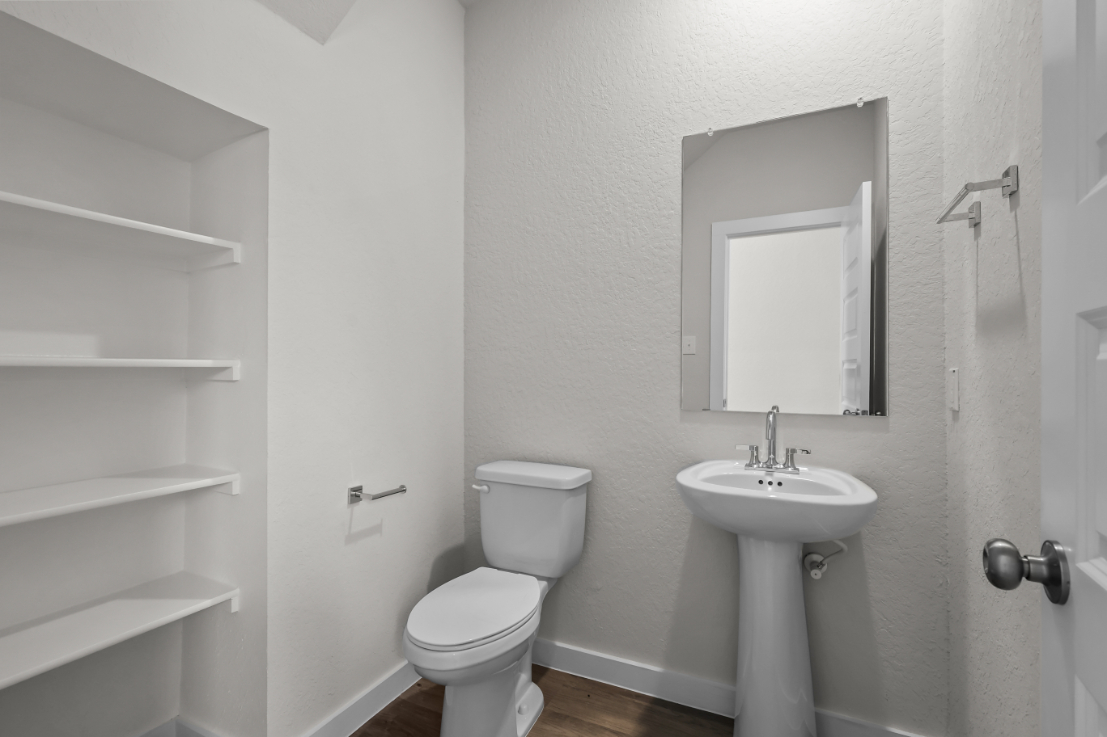 A bathroom with a sink and toilet.