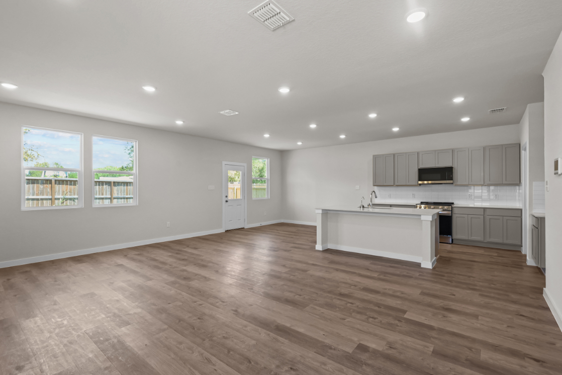 A large kitchen with white cabinets.