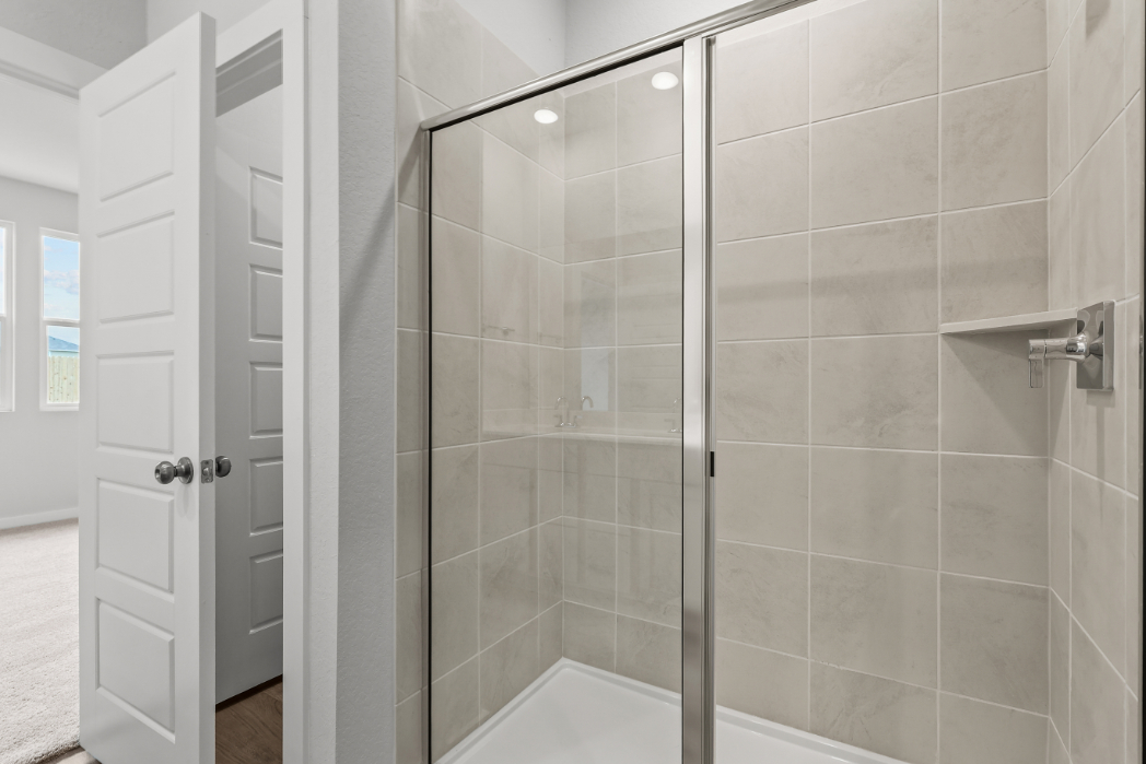 A shower with glass doors.