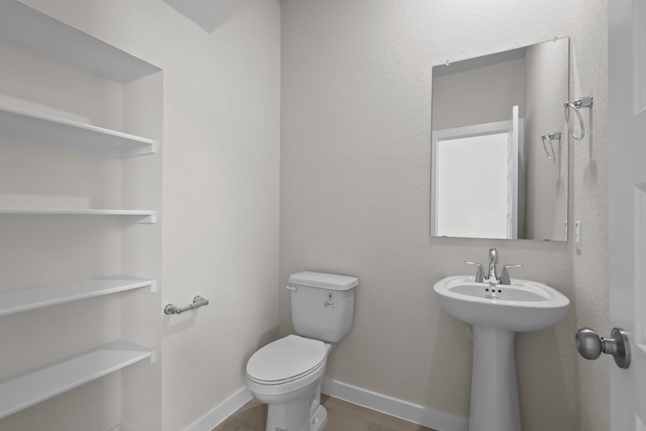 A bathroom with a sink and toilet.