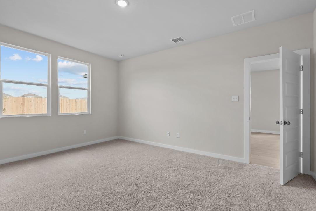 A room with a window and a door.