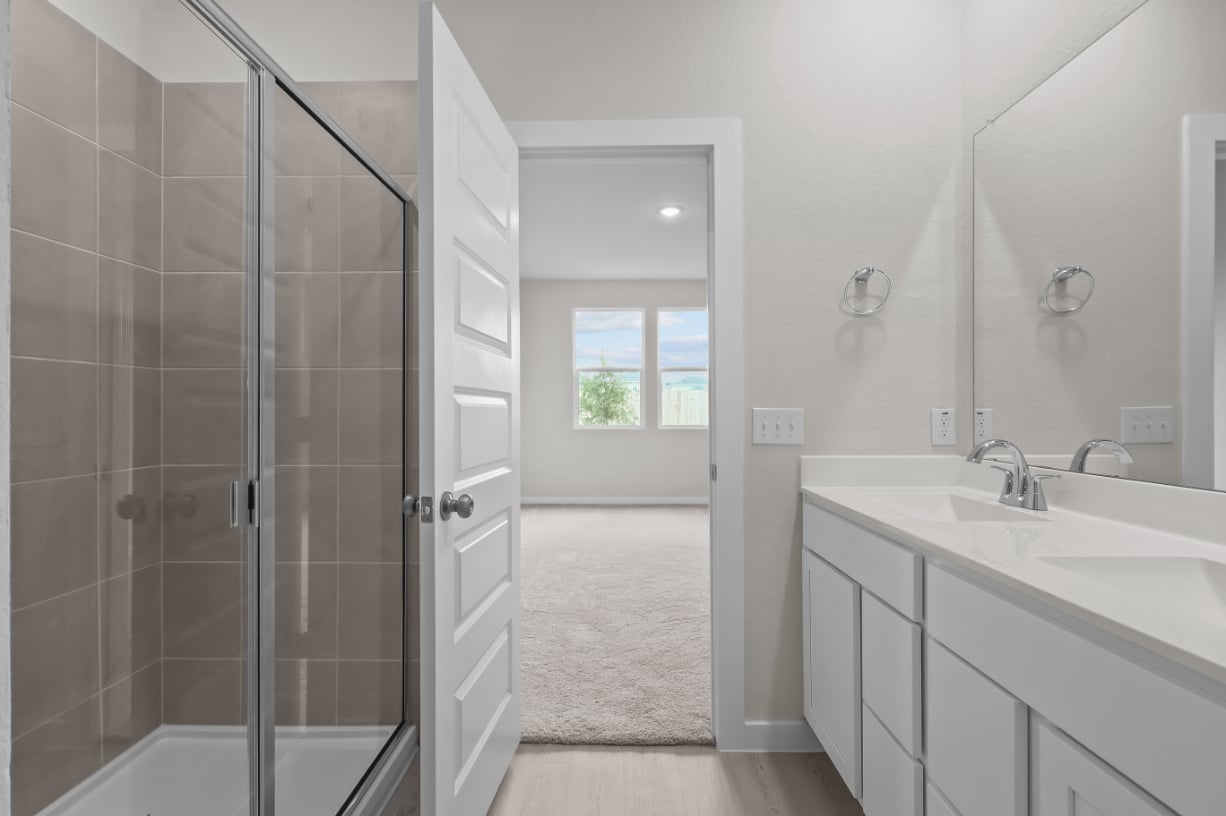 A bathroom with a glass shower.