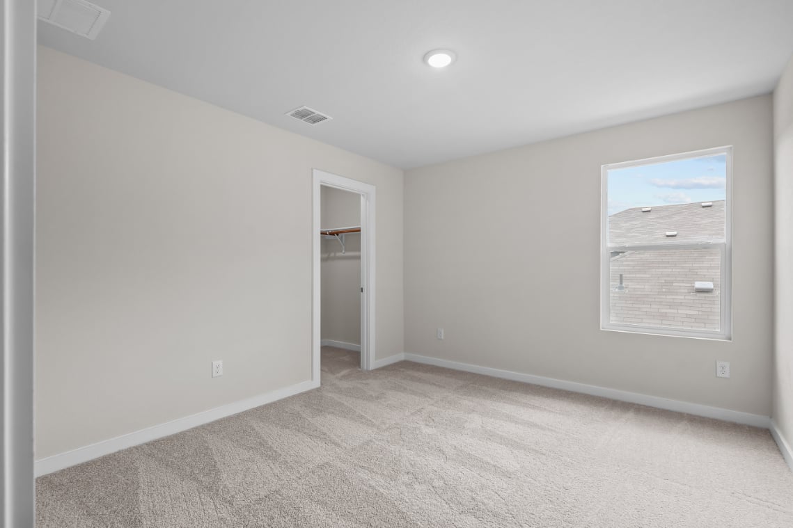 A room with a door and a window.