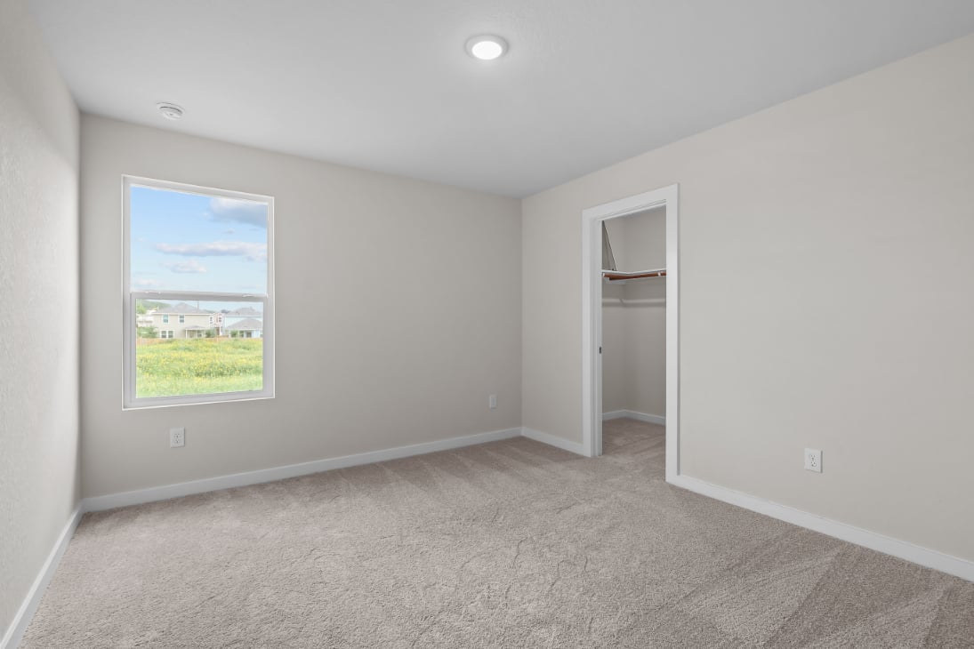A room with a window and a door.