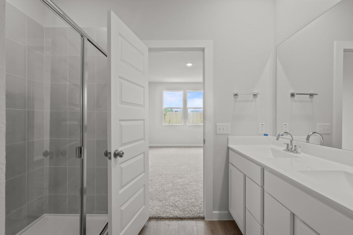 A bathroom with a glass shower.