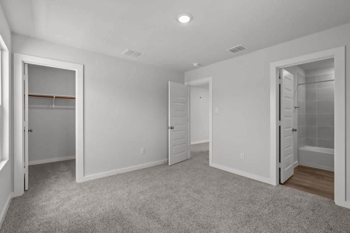 A room with white cabinets.