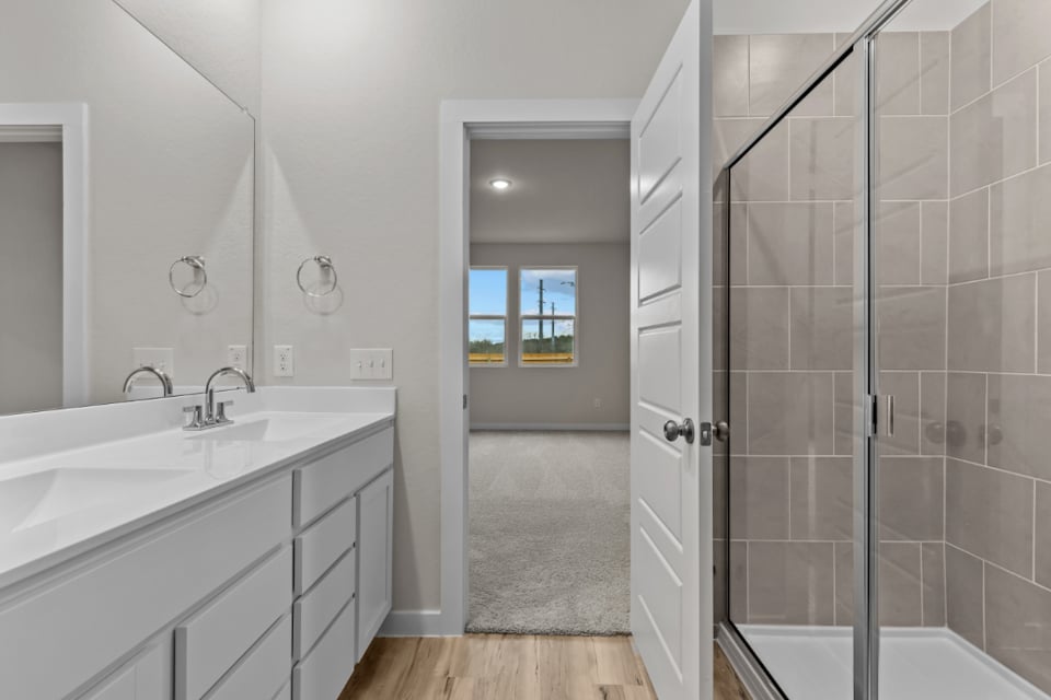 A bathroom with a glass shower.