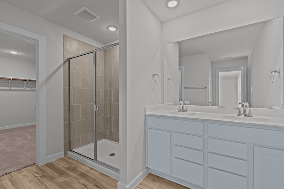 A bathroom with a glass shower.