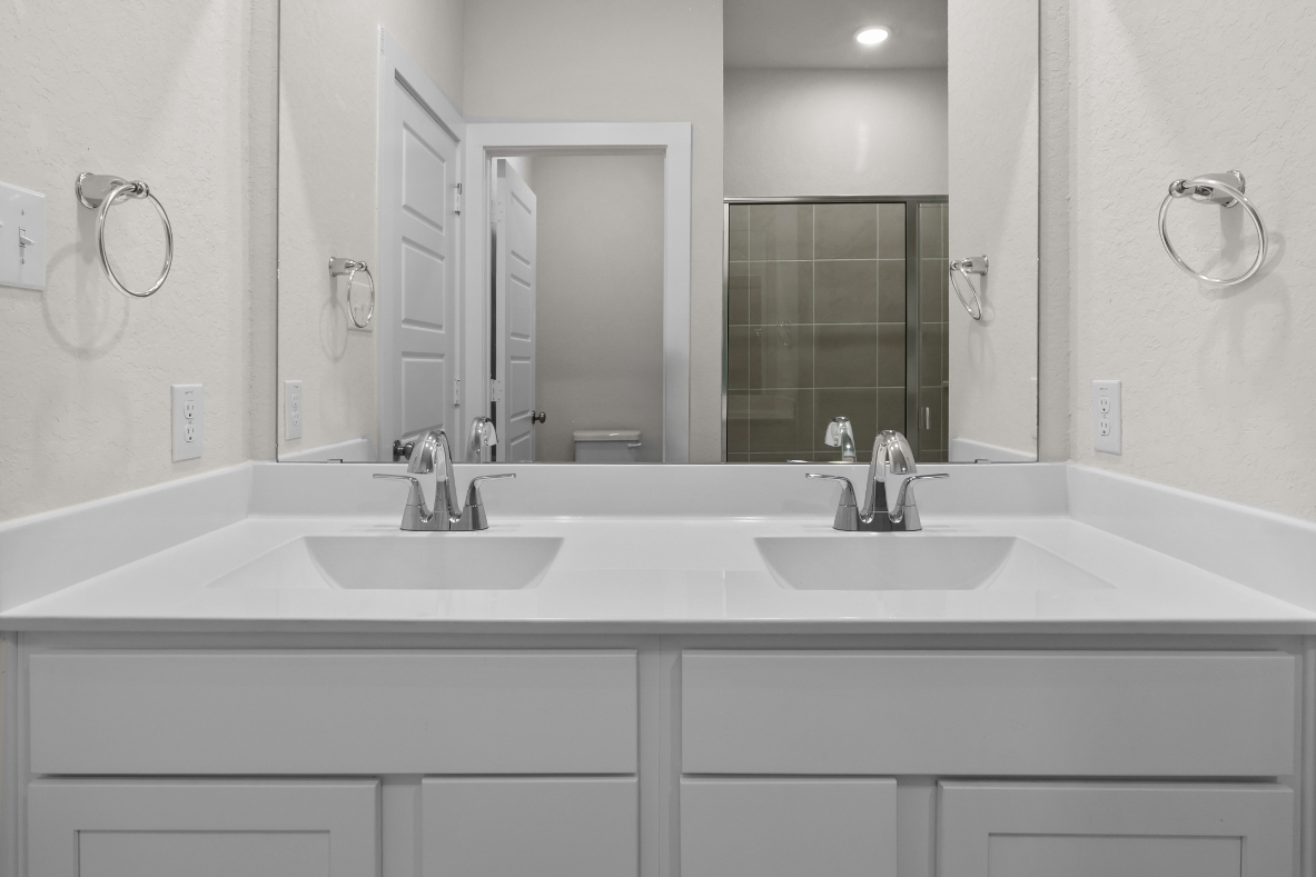A bathroom with two sinks.