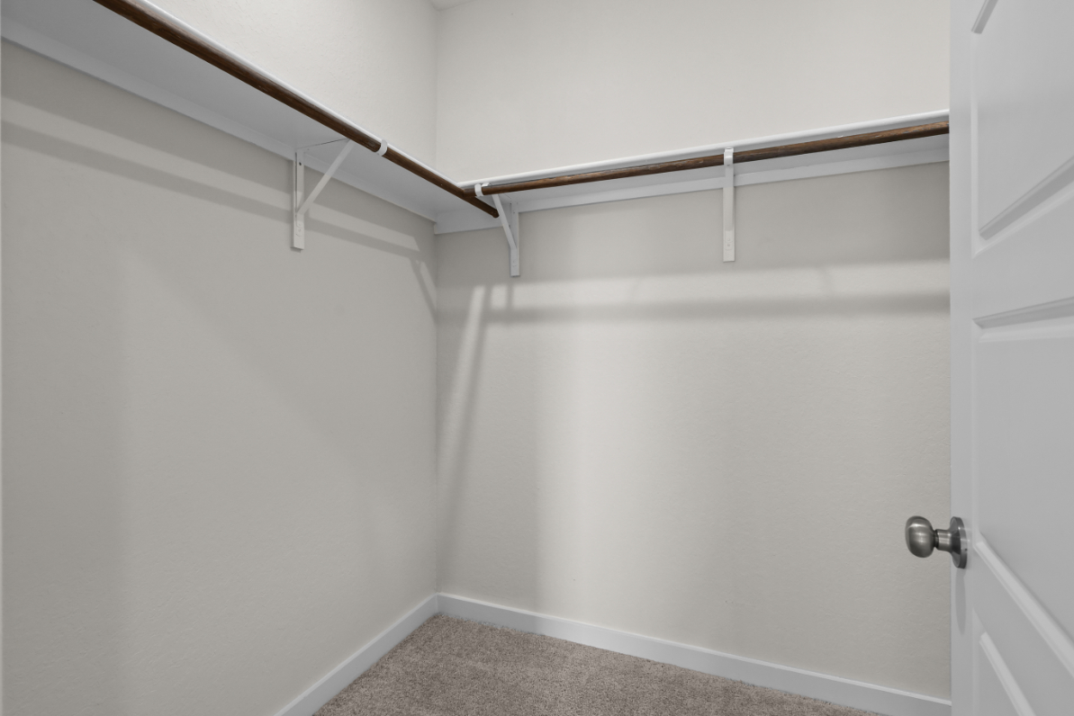 A white door with a metal railing.