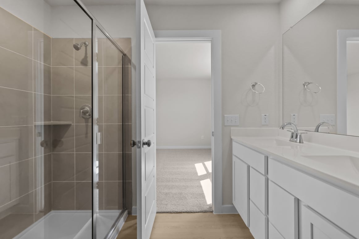 A bathroom with a glass shower.