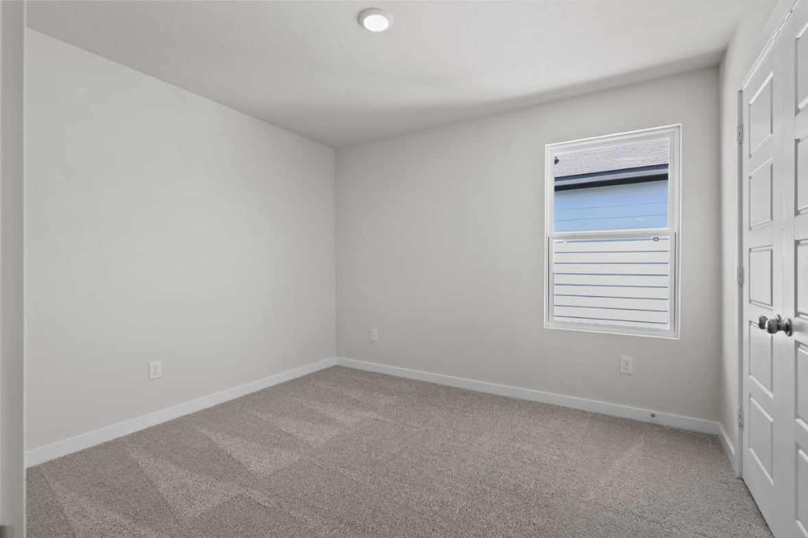 A room with a door and a window.