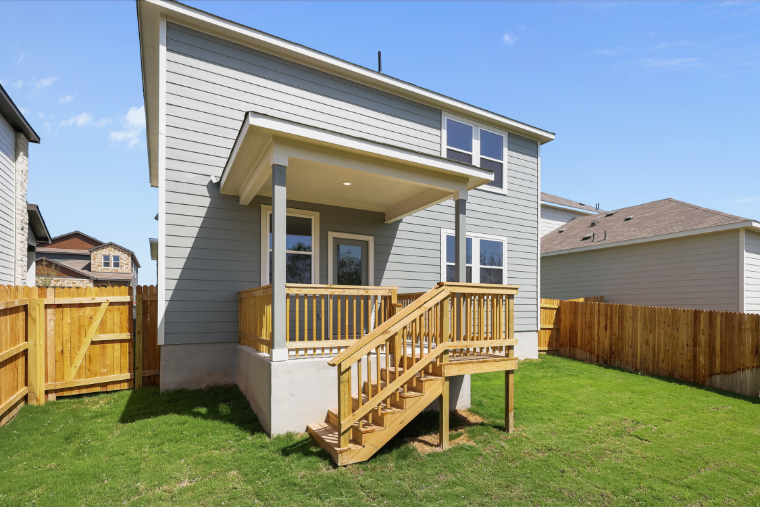 A small house with a deck.