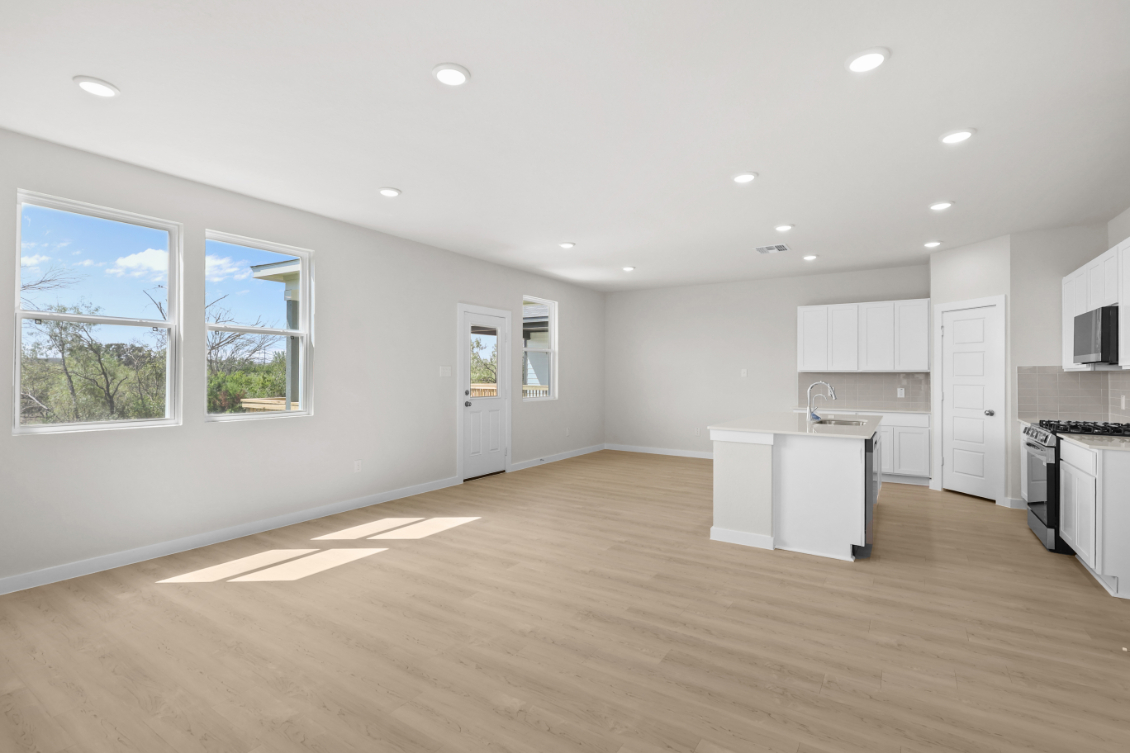 A large kitchen with white cabinets.