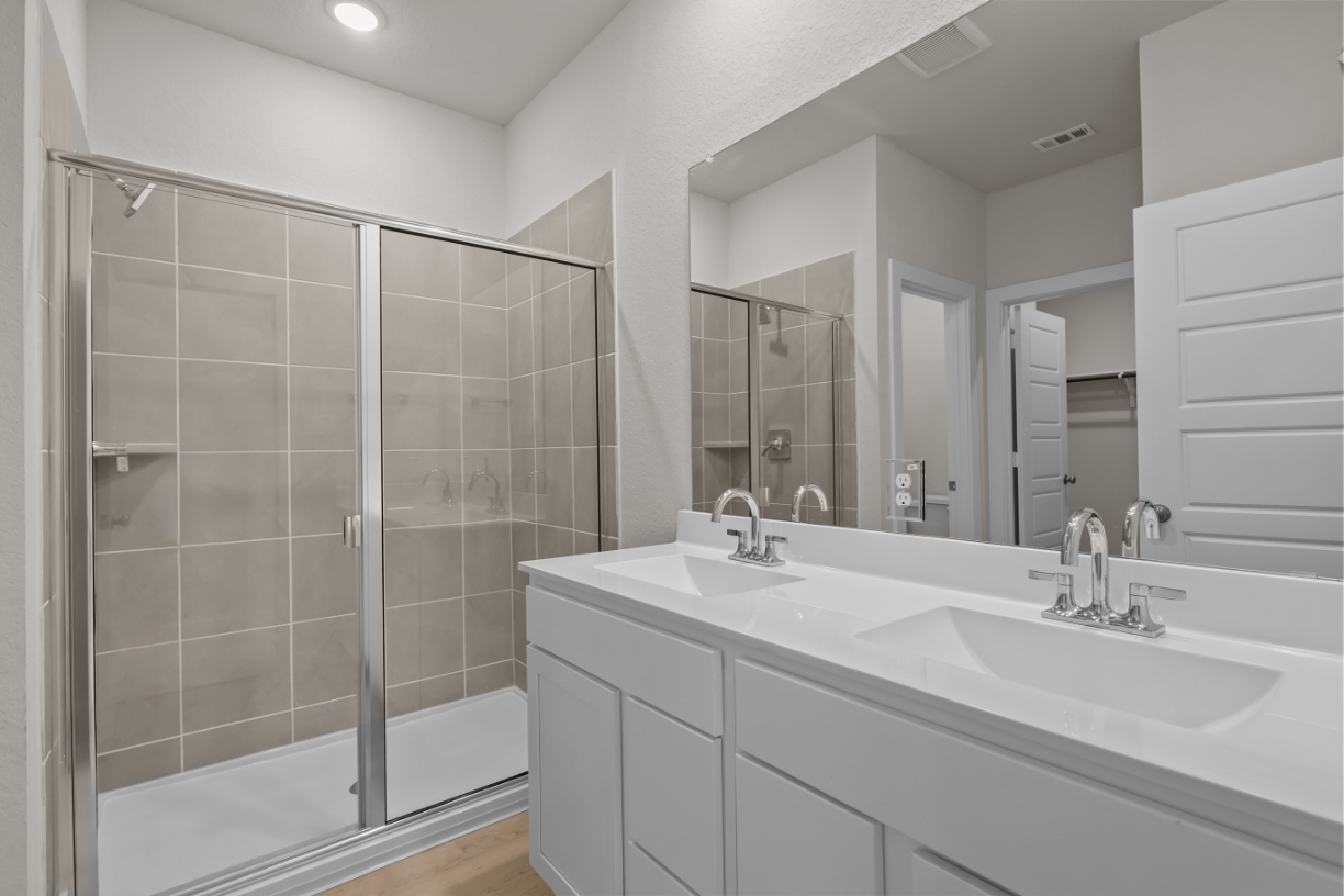 A bathroom with a glass shower.