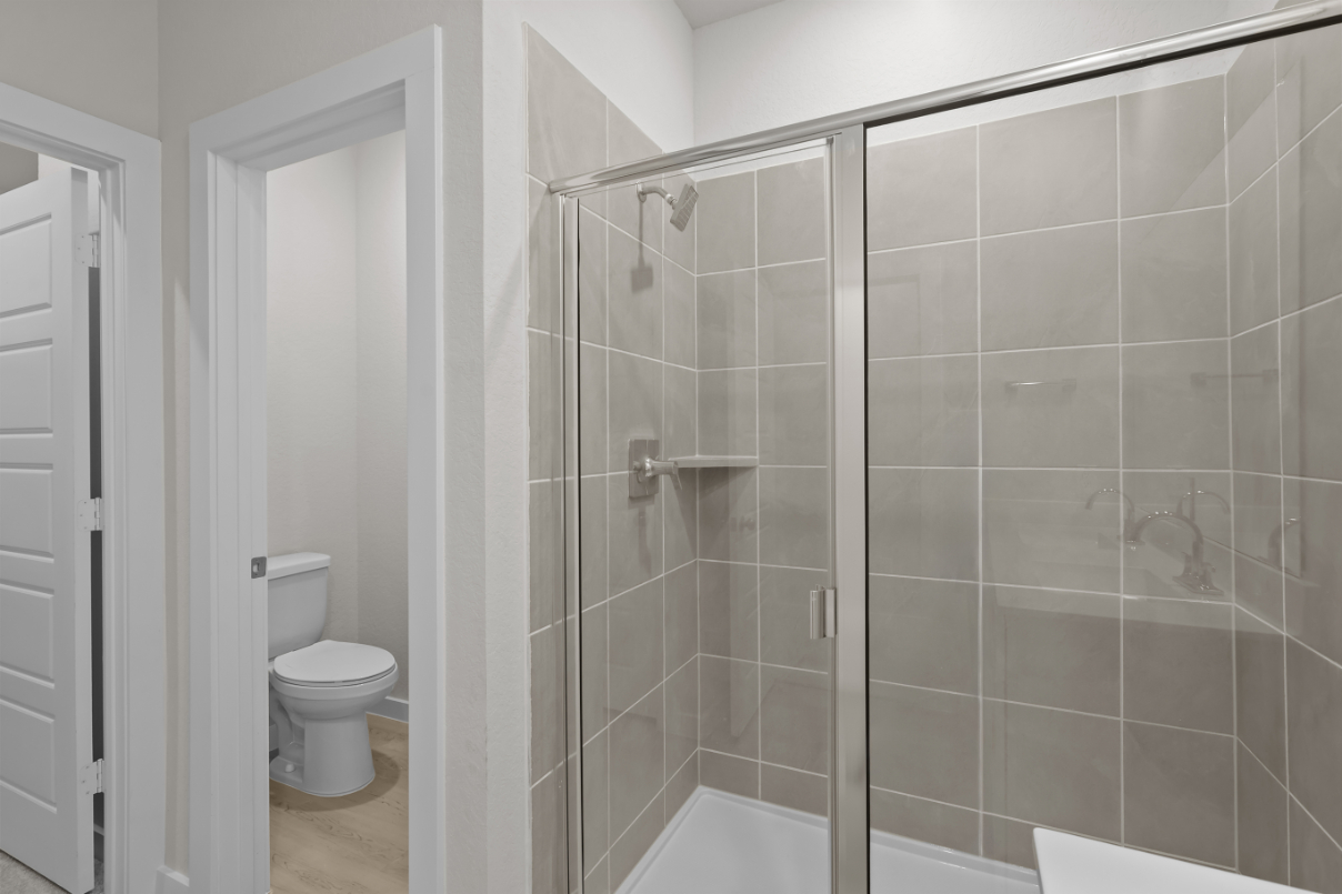 A bathroom with a glass shower.