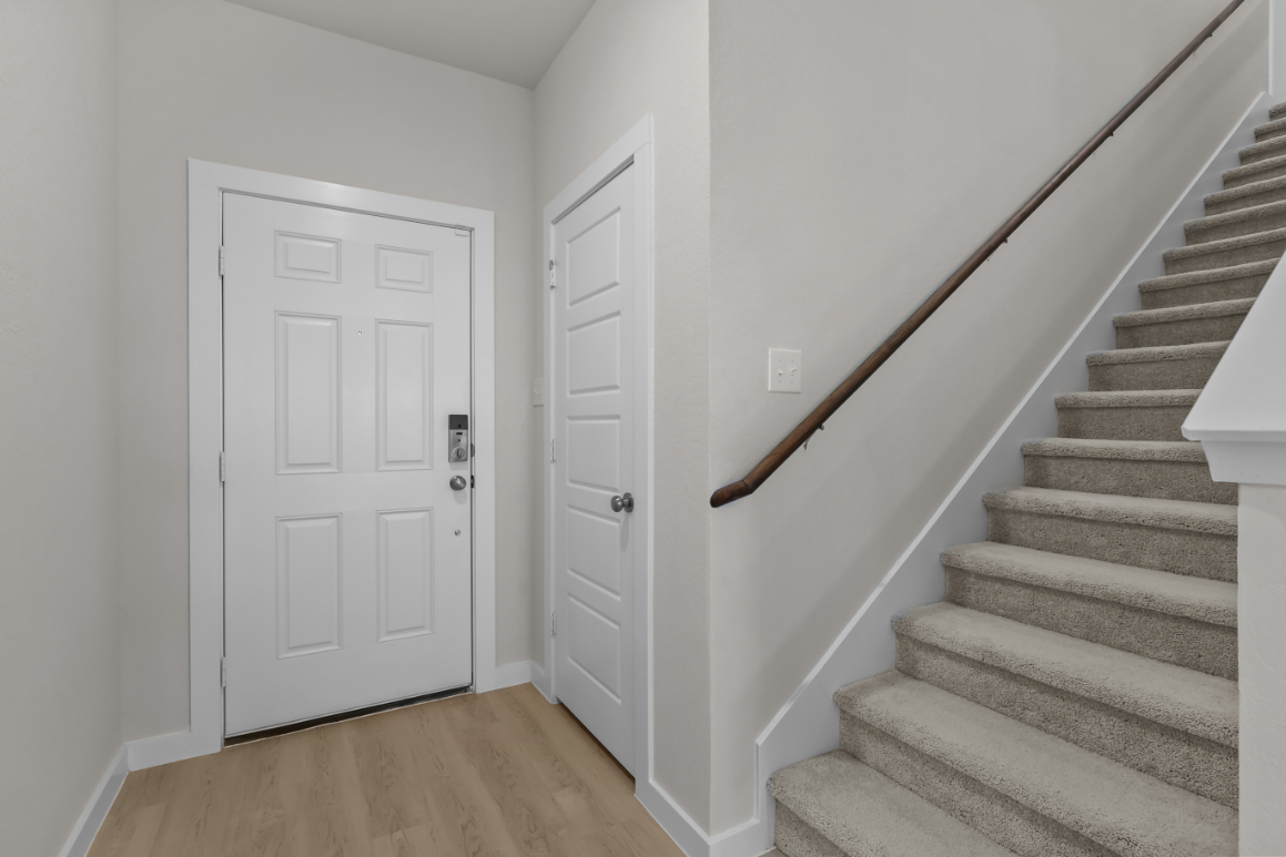 A staircase leading to a door.