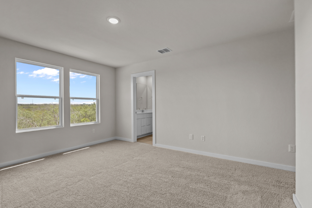 A room with a window and a door.