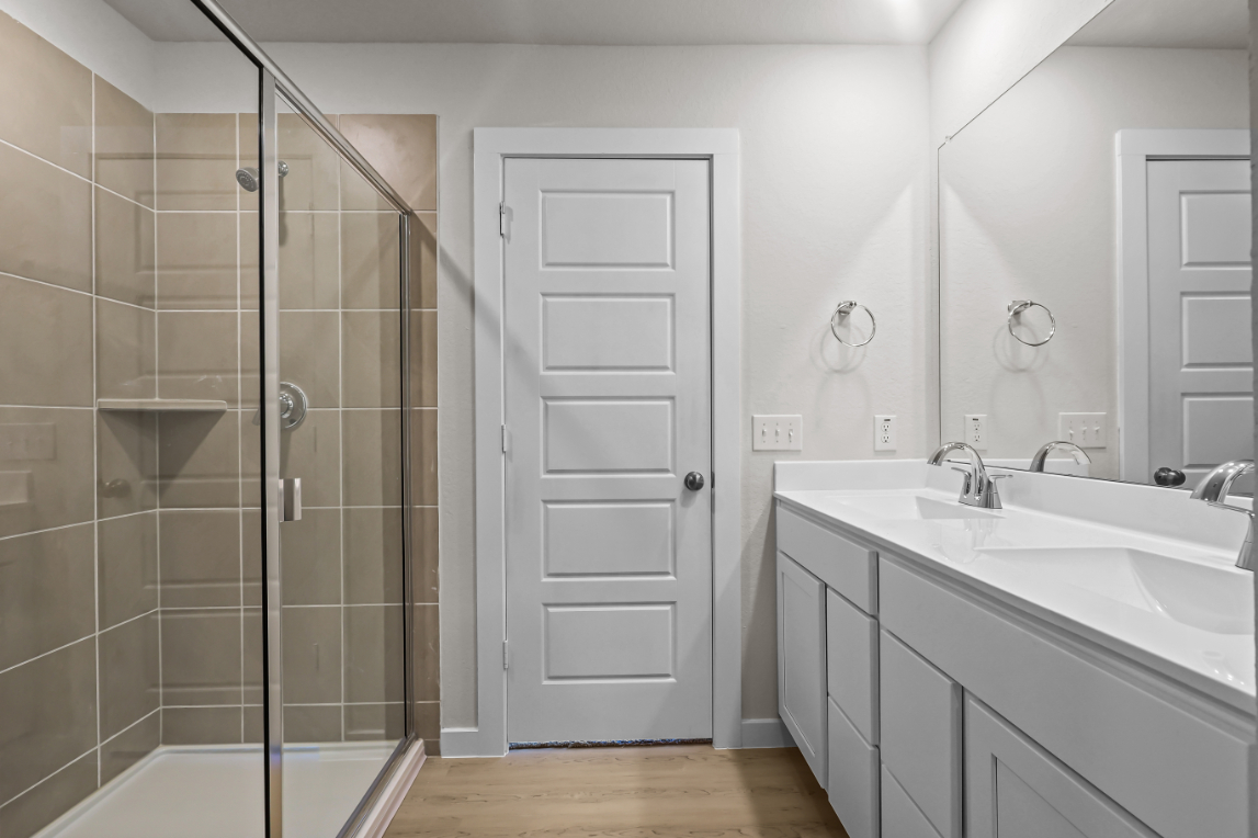 A bathroom with a glass shower.