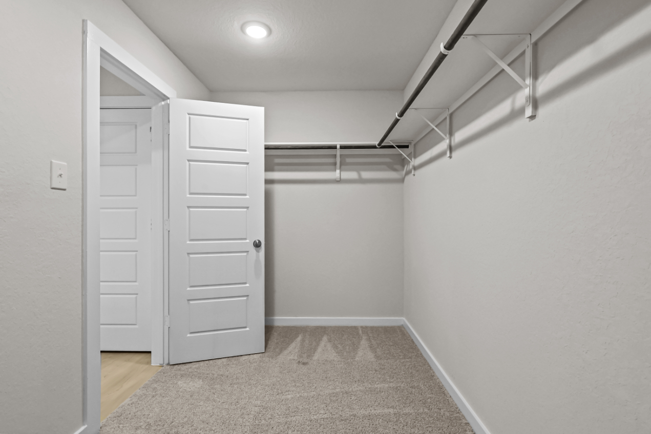A hallway with white doors.
