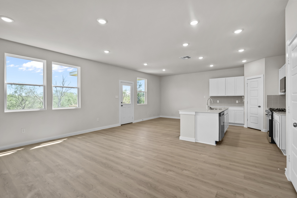 A large kitchen with white cabinets.