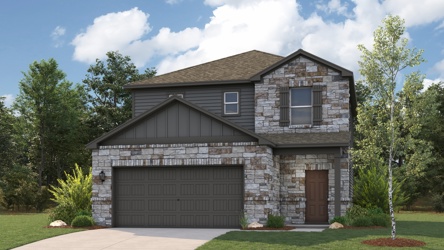 A stone house with a garage.