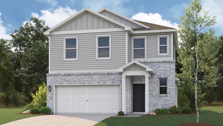 A white house with a garage.