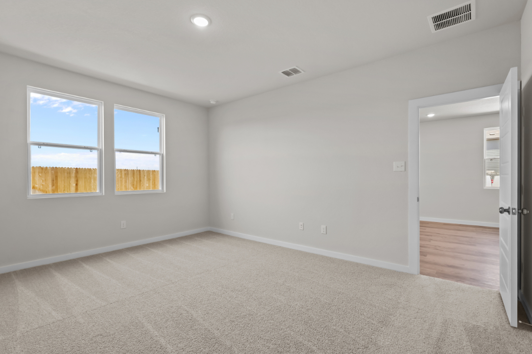 A room with a door and windows.