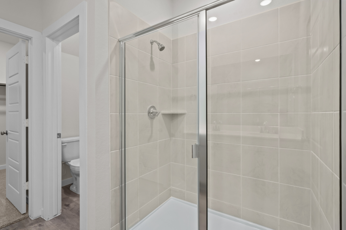 A bathroom with a glass shower.