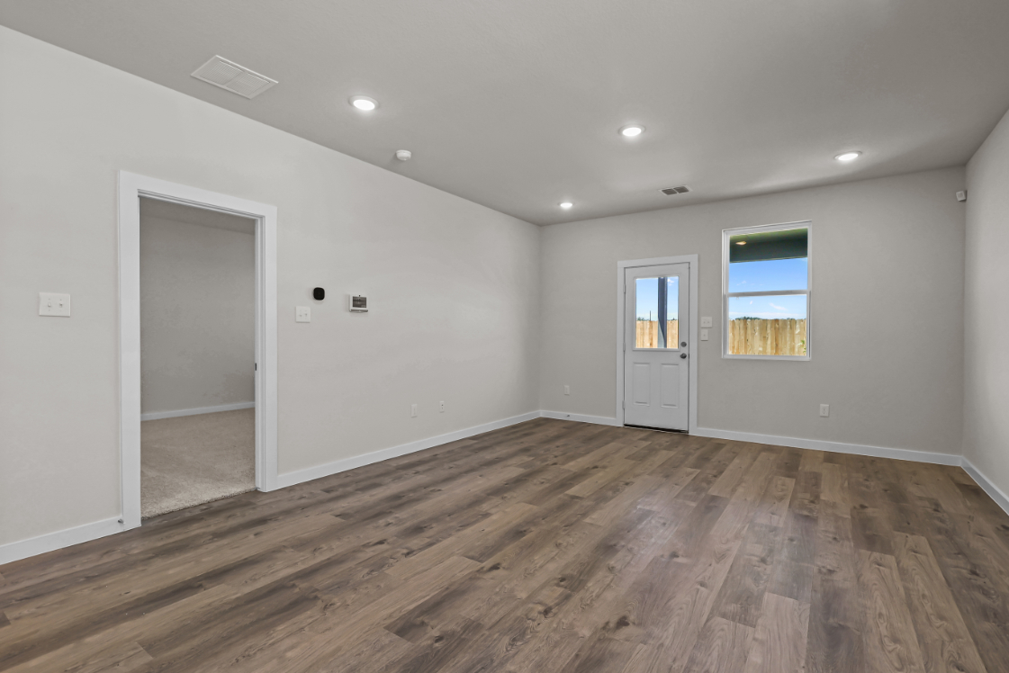 A room with a wood floor and a wood floor.