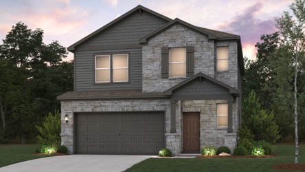 A grey house with a driveway.