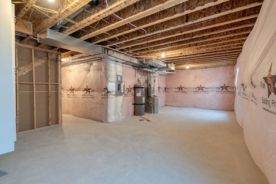 A large room with a few doors.