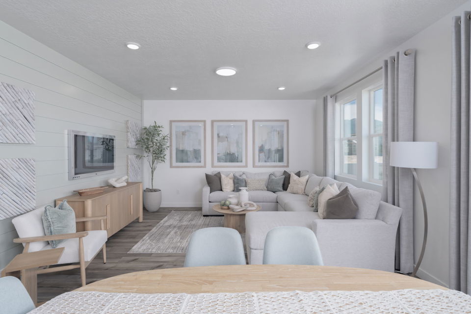 A living room with a couch and a table.