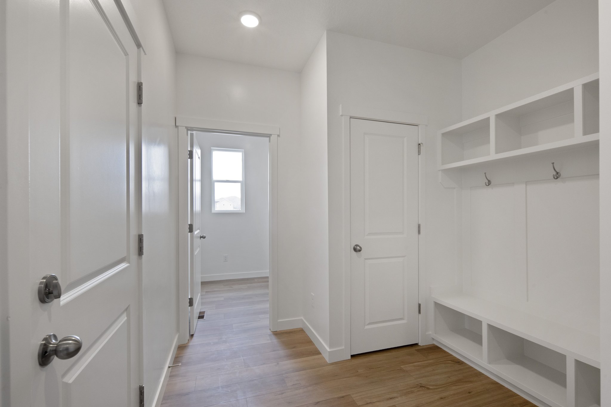 A room with white cabinets.