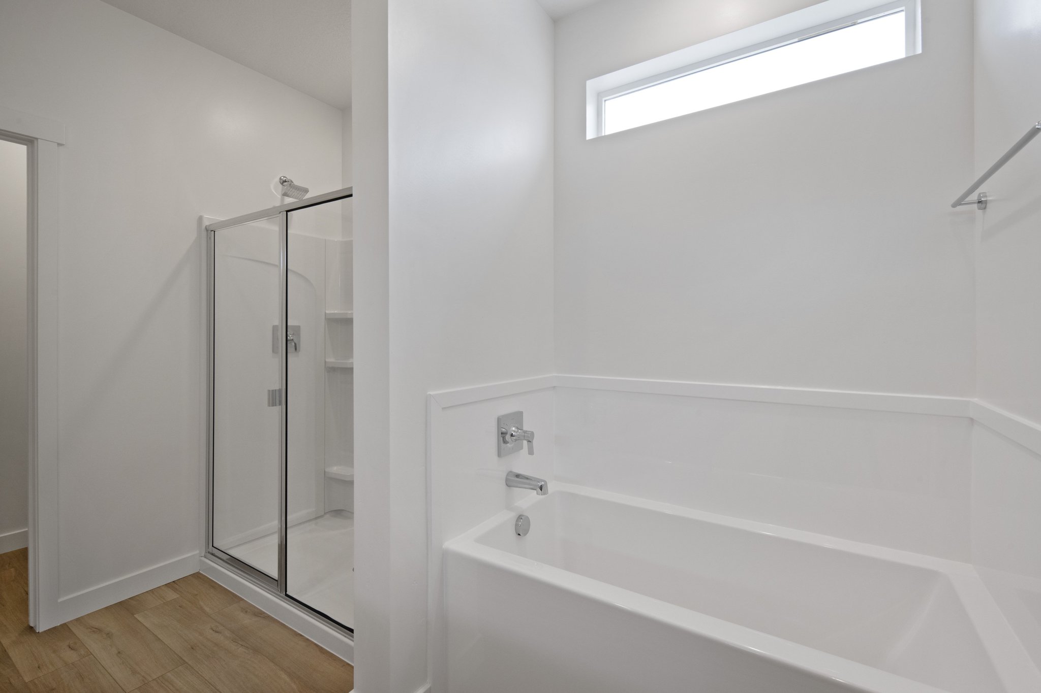 A bathroom with a glass shower.