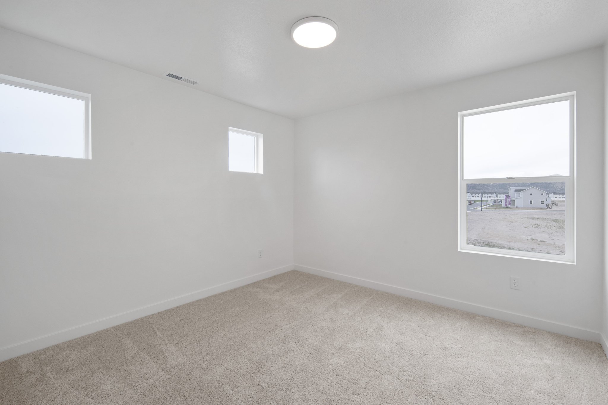 A room with a few windows.