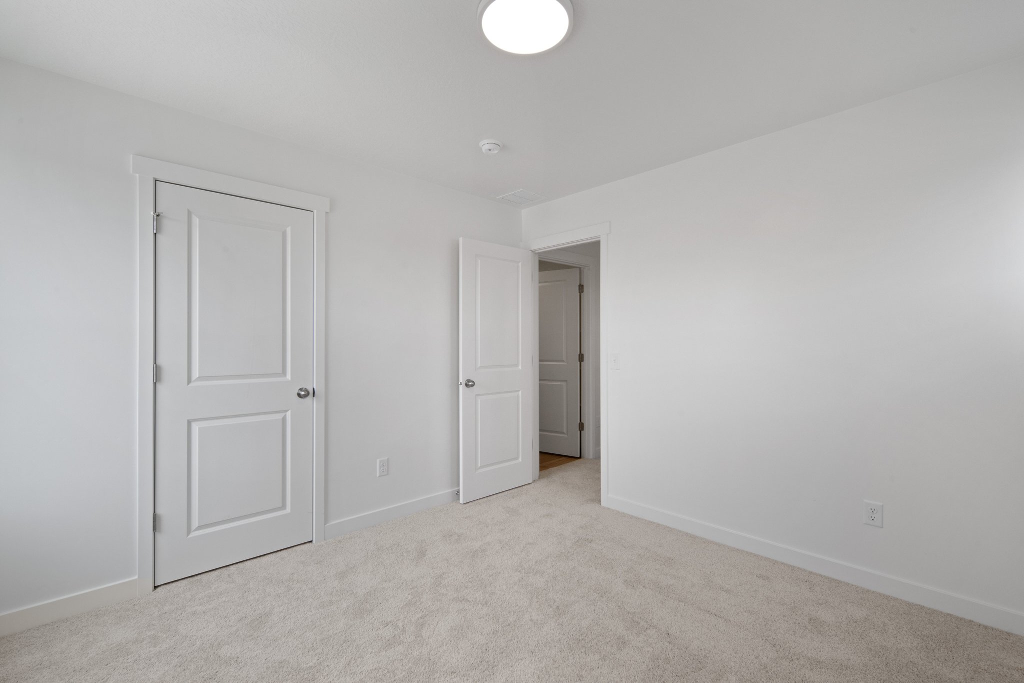 A room with white doors.