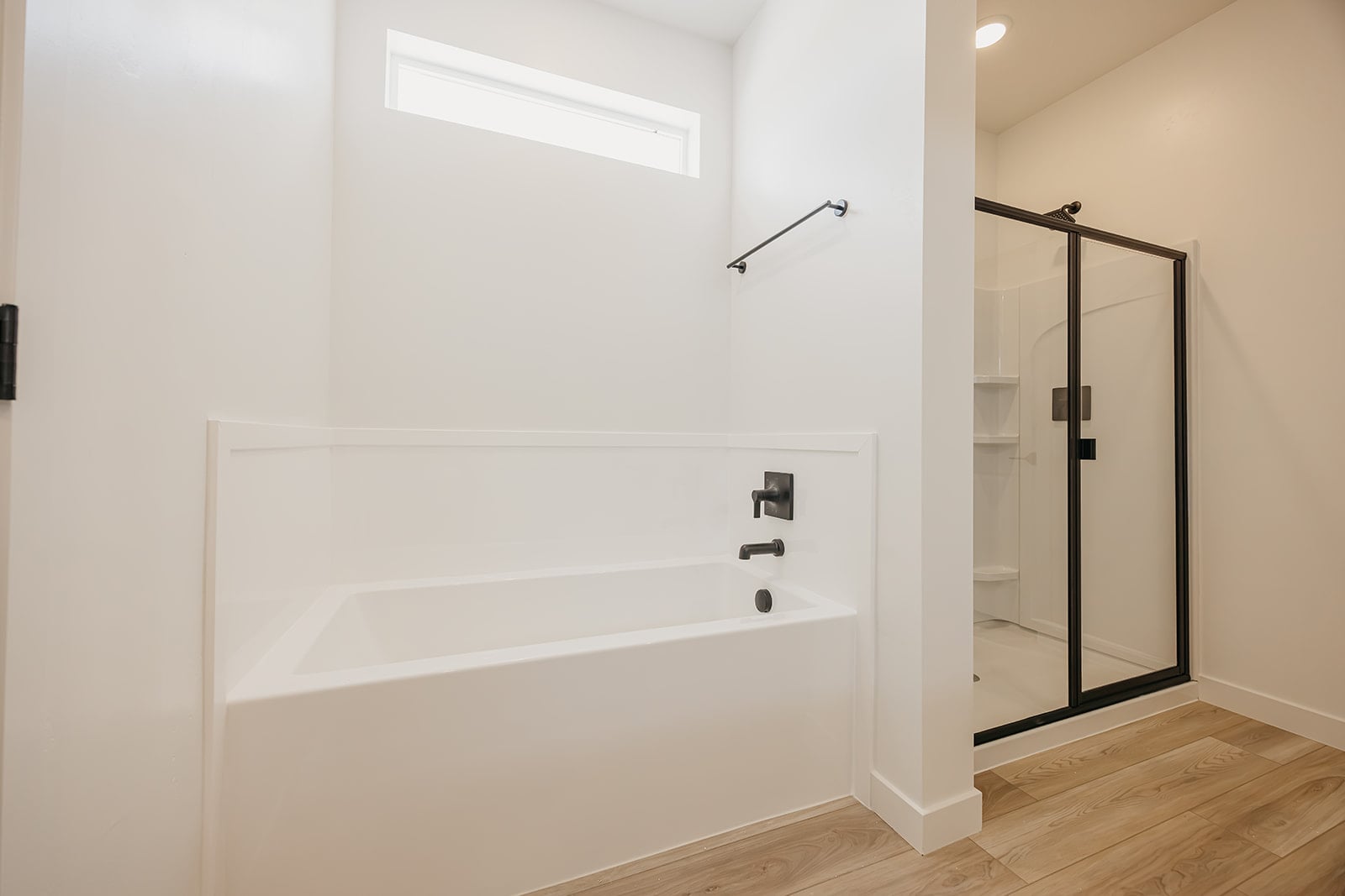 A bathtub in a bathroom.