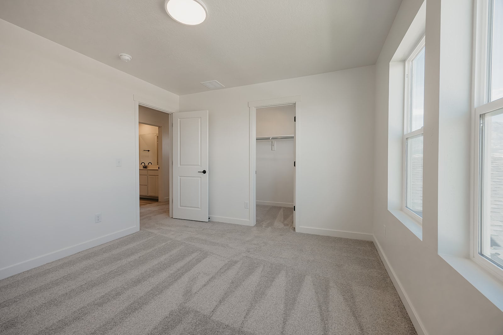 A long hallway with white walls.