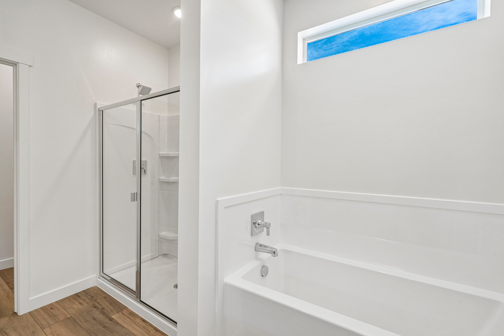 A bathroom with a glass shower.
