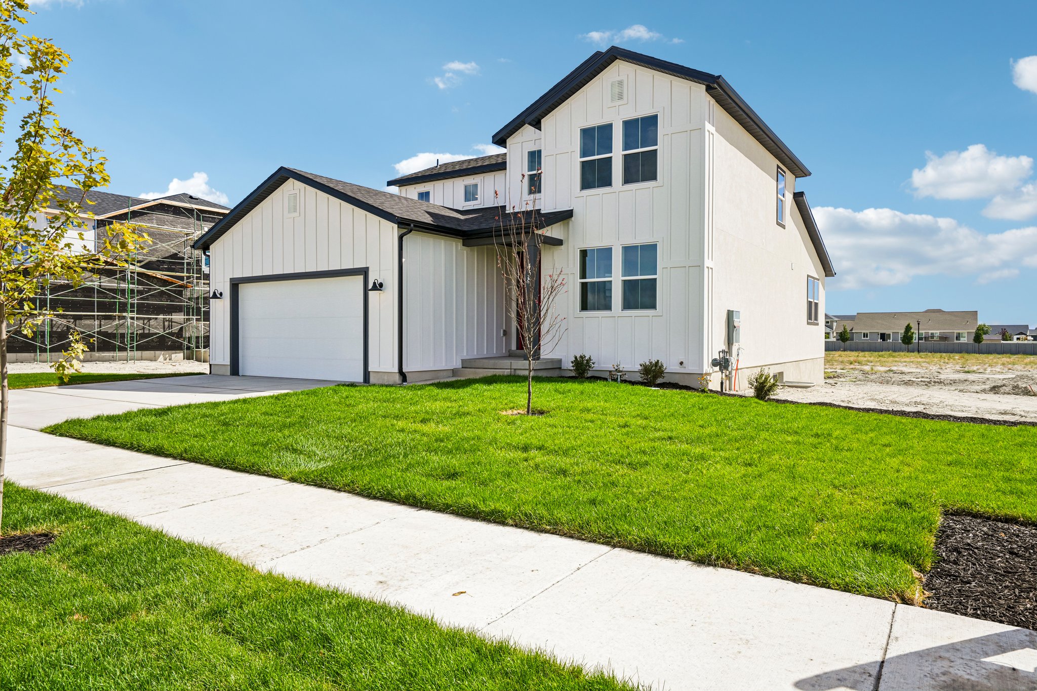 A white house with a garage.