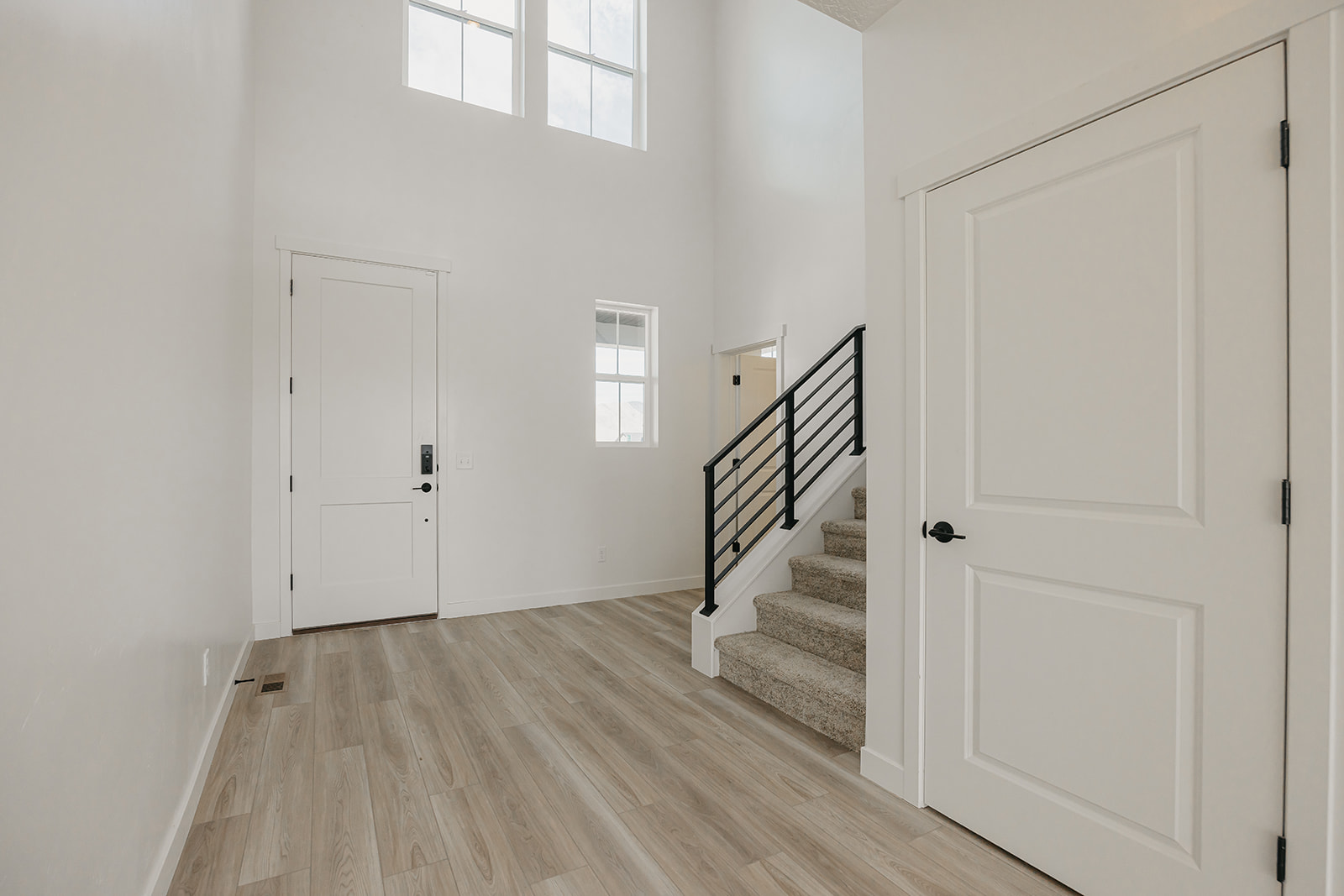 A hallway with white doors.