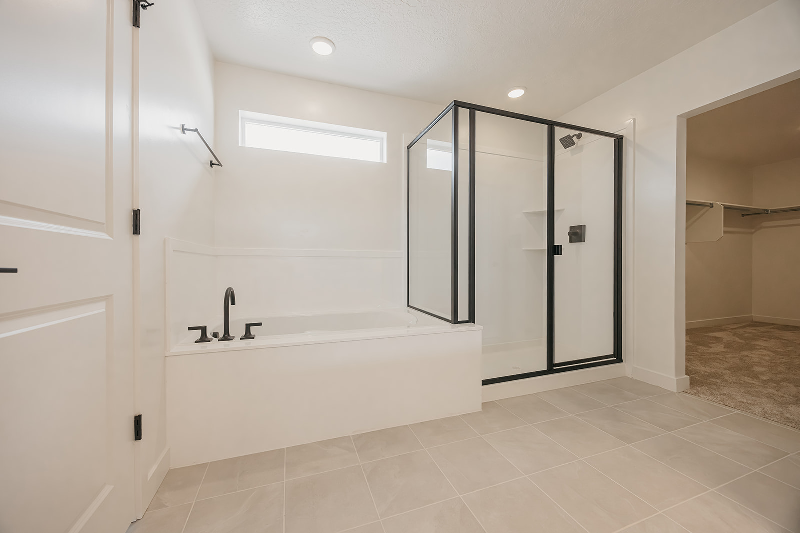 A bathroom with a bathtub and shower.
