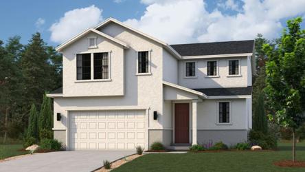 A white house with a driveway.