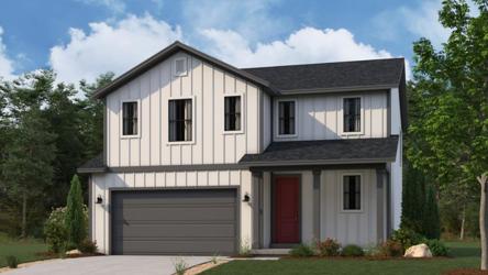 A white house with a garage.